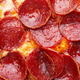 Close-up on slice of pepperoni pizza